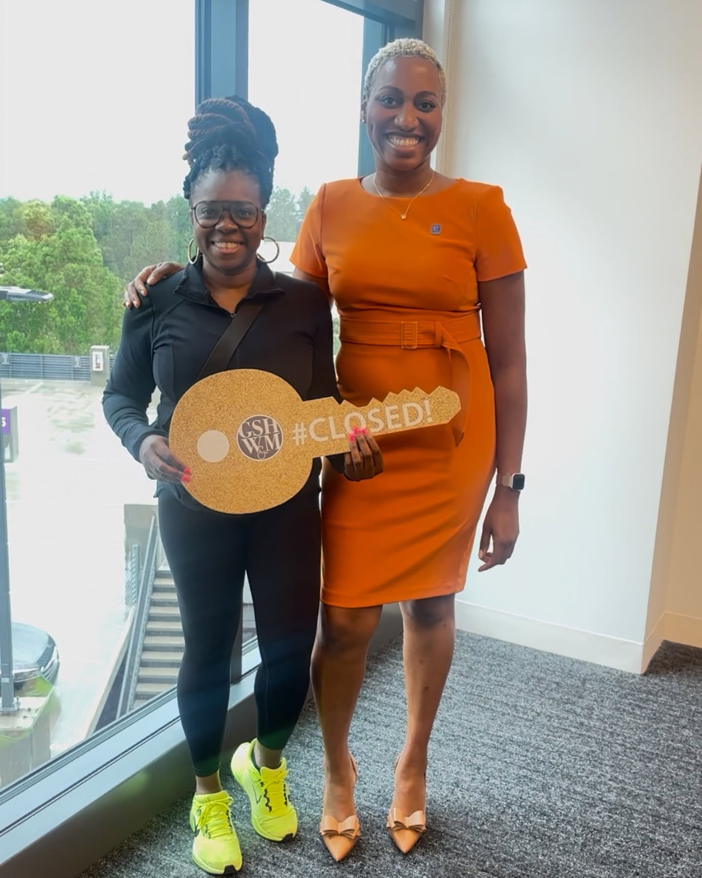 Jacqueline Walker with seller Natasha Davis after the closing of 5883 Brookside Oak Circle.